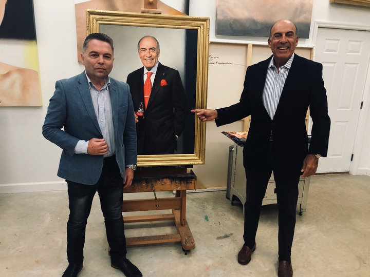 Artist Ross Rossin presents portrait to former Coca-Cola CEO, Muhtar Kent painted